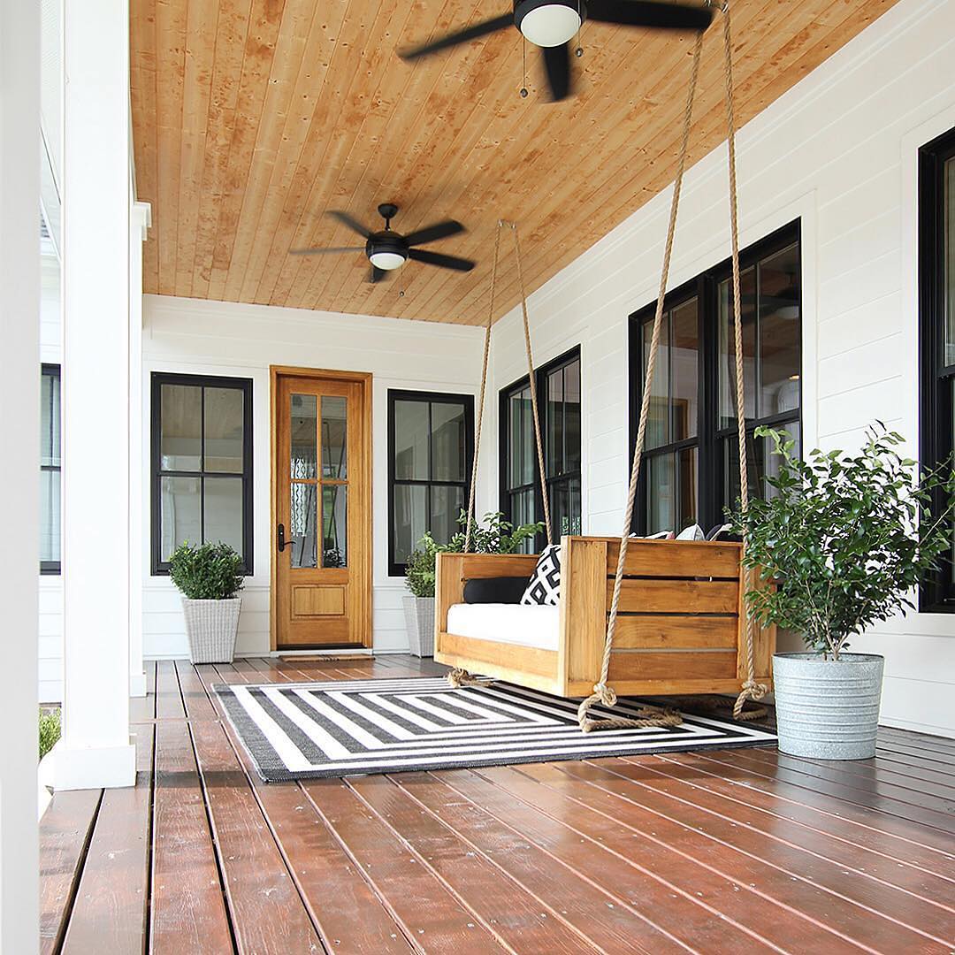 Chic Front Porch With Swings